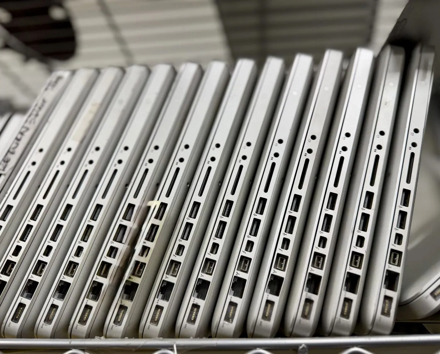 Retired business laptops staged for recycling at Erecycler